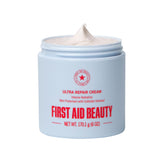 First Aid Beauty Ultra Repair Cream – flacon visage et corps, hydratation durable.