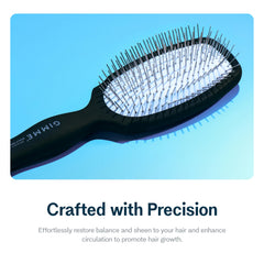 Brosse GIMME Beauty avec poignée ergonomique pour un style confortable.