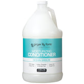 Ginger Lily Farms Club & Fitness Ocean Breeze conditioner bottle for smooth, hydrated hair.