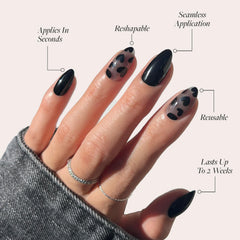 Glamnetic Love Me Not nails with glossy black heart accents for date nights.