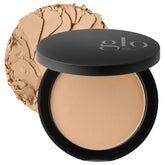 Glo Skin Beauty poudre pressée, teinte Miel Moyen, emballage compact prêt pour les retouches.