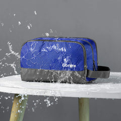Gonex trousse bleu ouverte, montre les compartiments principaux et la poche filet.