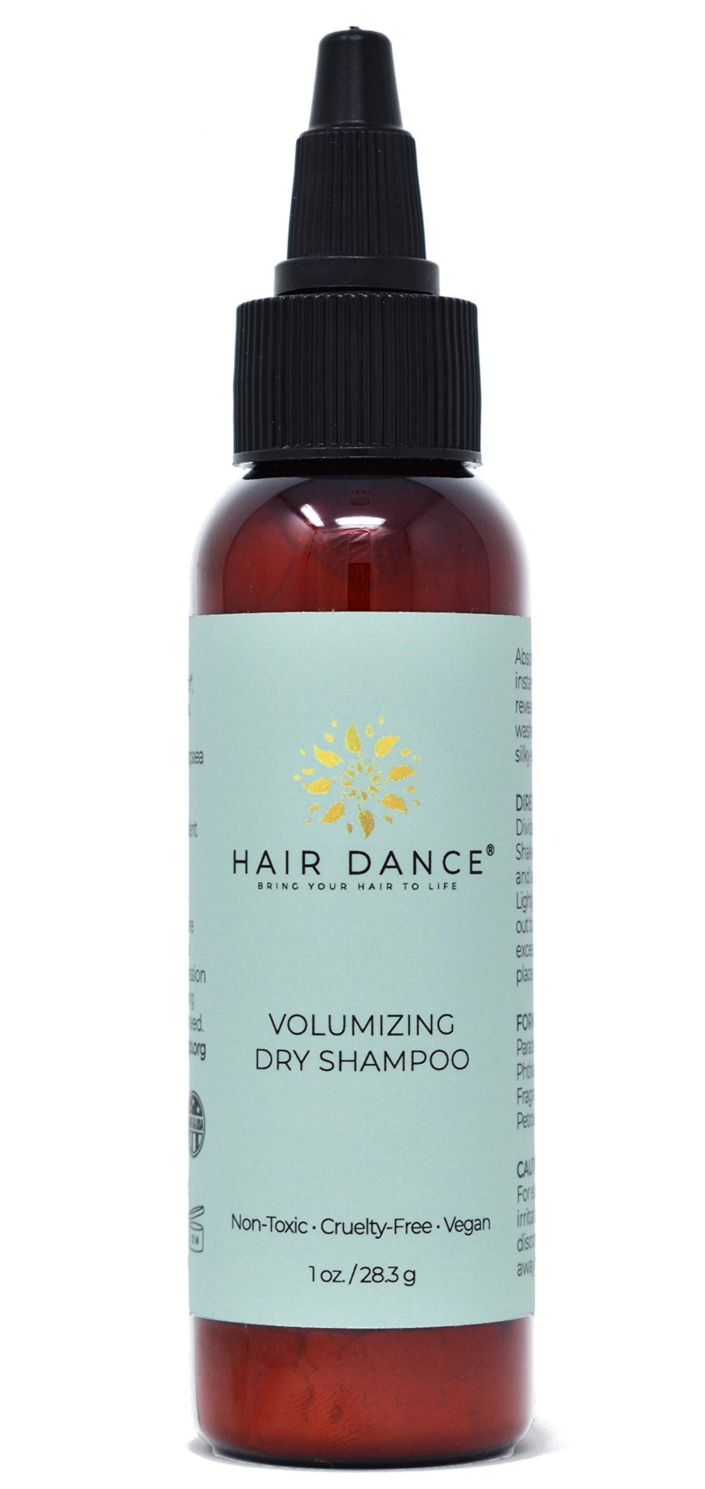 Hair Dance Poudre Volume: bouteille visible pour des racines fraîchement volumisées.