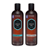 Shampoing réparateur HASK à l'huile d'argan dans une bouteille, nettoie en douceur et protège les cheveux