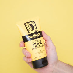 Flacon HeadSlick affichant texture lisse et glisse fluide.