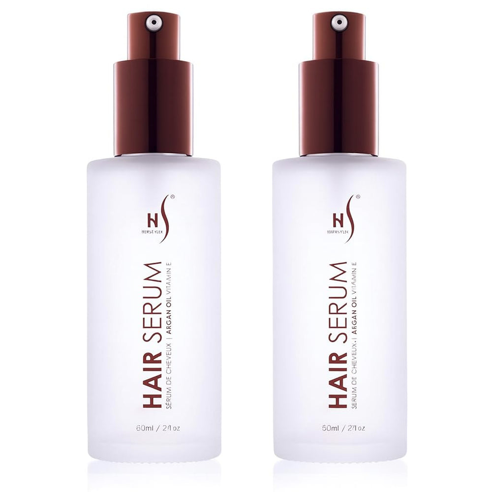Herstyler Argan Oil Serum bottle glistens with natural shine for all hair types.