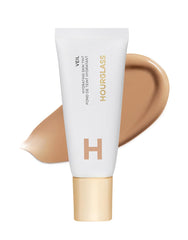 Hourglass Veil Hydrating Skin Tint dans sa bouteille, hydratation légère pour un éclat naturel.