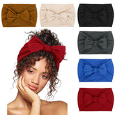 Huachi bandeau-cheveux noir avec noeud frontal, maintien fiable et style chic.