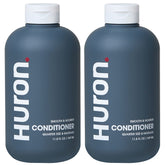 Huron après-shampooing léger, bouteille visible, hydrate et facilite le coiffage.
