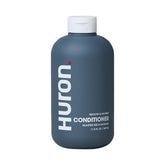Huron pour hommes: bouteille hydratante offrant des cheveux plus souples.