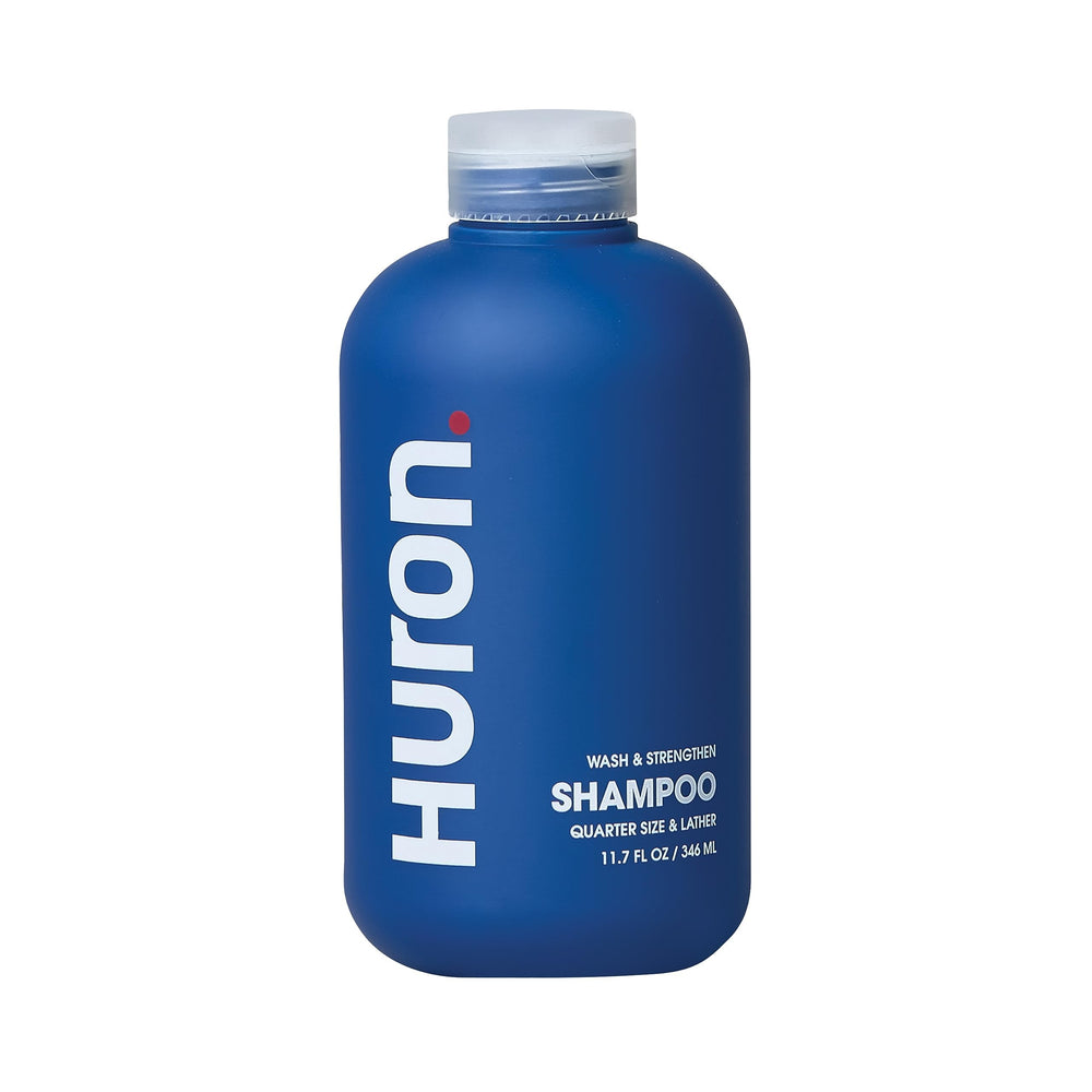 Shampoing Huron pour homme - bouteille visible, hydratation et propreté quotidiennes.