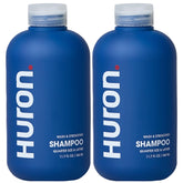 Shampoing Huron Citrus Bois pour homme, bouteille et étiquette visibles, hydratation potentielle.