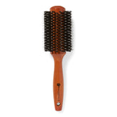 Ion brosse ronde en bois doré, poils de sanglier, pour cheveux épais et volumineux.