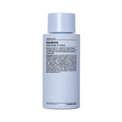 Shampoing J Beverly Hills Blue Solutions en bouteille bleue pour éliminer les résidus et hydrater.