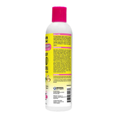 Jamaican Mango & Lime lotion hydrate les cheveux pendant le démêlage des tresses.