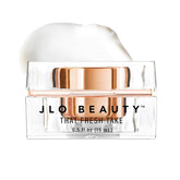 Crème Yeux JLO BEAUTY 0,5 oz, texture légère pour hydrater et lisser le contour.