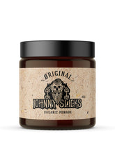Johnny Slicks Originale dans sa bouteille, prêt pour une application hydratante.