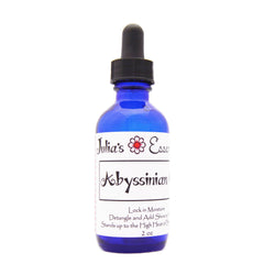 Julia's Essentials huile abyssinienne pure en bouteille, hydratation et douceur pour cheveux.