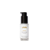 JVN Complete Blowout Styling Milk bottle pour showing easy application and heat protection preparation.