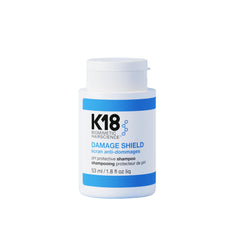 K18 Damage Shield – bouteille, soin capillaire pH optimisé pour préserver couleur et brillance.