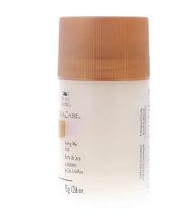 Keracare bâton cire coiffante, démonstration de texture et application précise.