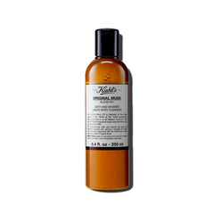Kiehl's Original Musk – flacon en gros plan et mousse satinée prête à l'emploi.