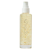 Kopari huile-corps doree 24k, flacon élégant prêt à hydrater la peau.