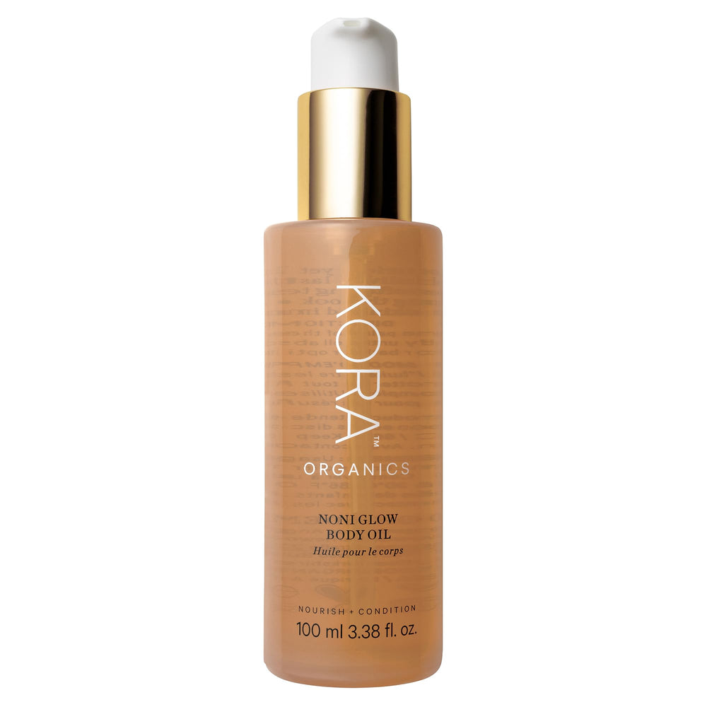 Huile Noni Glow KORA Organics: bouteille prête pour hydratation légère.