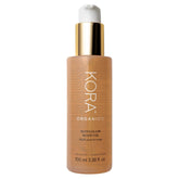 Huile Noni Glow KORA Organics: bouteille prête pour hydratation légère.