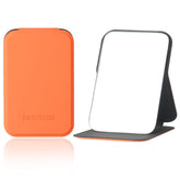 Miroir Korutomi de poche ultrafin orange pour retouches rapides en déplacement.