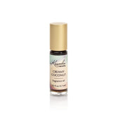 Kuumba Made Huile Parfum Coco Crémeux, flacon roll-on portable pour une fragrance durable.