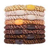 L. Erickson brown hair ties close-up in bronze metal for strong, damage-free styling.