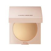 Laura Mercier Poudre finissante lumineuse compacte pour un éclat naturel.