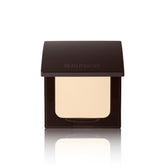 Laura Mercier poudre pressée translucide sur compact avec applicateur inclus, retouches faciles tout au long de la journée.