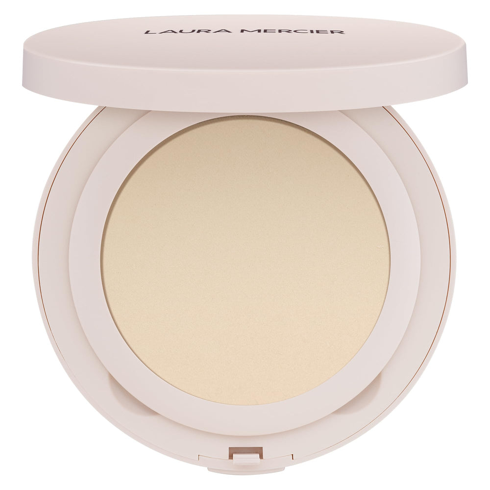 Laura Mercier Ultra-Blur poudre compacte transparente, fini naturel et pores visiblement floutés.