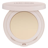 Laura Mercier Ultra-Blur poudre compacte transparente, fini naturel et pores visiblement floutés.