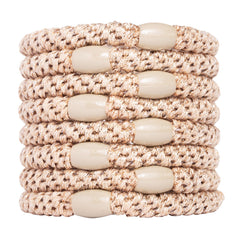 L. Erickson: bandes cheveux dorées beige, fini métallique pour un style discret et durable.