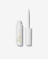 Lilly Lashes clear glue bottle with brush-on applicator for precise lash placement.