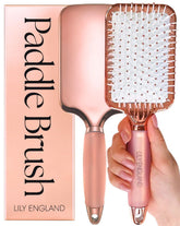 Brosse Lily England Paddle rose doré et blanc démêlage en douceur.