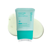 Lilyeve SCALPTURN avec brosse intégrée pour une application précise sur le cuir chevelu.
