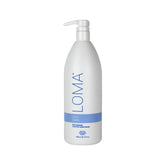 Loma Crème Apaisante en bouteille 1 L, prêt à démêler et protéger les longueurs.