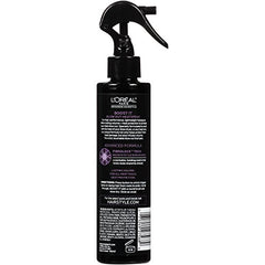 Spray BOOST IT en action offrant une protection contre la chaleur et du volume