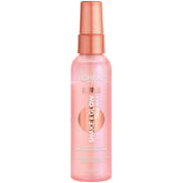 L'Oreal Paris LUMI Shake and Glow Dew Mist bottle activated for dewy hydration.