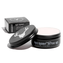 Mad Rabbit Tattoo Balm bottle close-up showing hydration for vibrant ink.