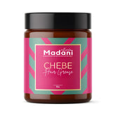 Madani Naturals Chebe Grease montre une bouteille au romarin, soin capillaire nourrissant.