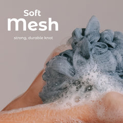 Gant exfoliant MainBasics avec noeud renforcé, durabilité accrue.
