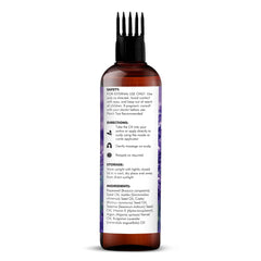 Texture riche d'huile de lavande Majestic Pure sur cheveux lisses.