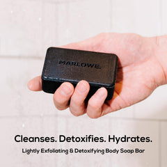 MARLOWE No. 106 charcoal soap bar closeup lather highlights gentle exfoliation and smooth skin