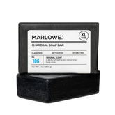 MARLOWE No. 106 charcoal soap bar pour demonstrates deep cleansing and a woodsy scent