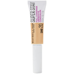 Maybelline anti-cernes avec pinceau plat sur l’œil, couvrance homogène et longue tenue.